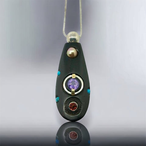 Purple Sapphire, Garnet and Gold Grenadilla Pendant