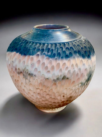 Sagga fired vessel with black n pink. Carved