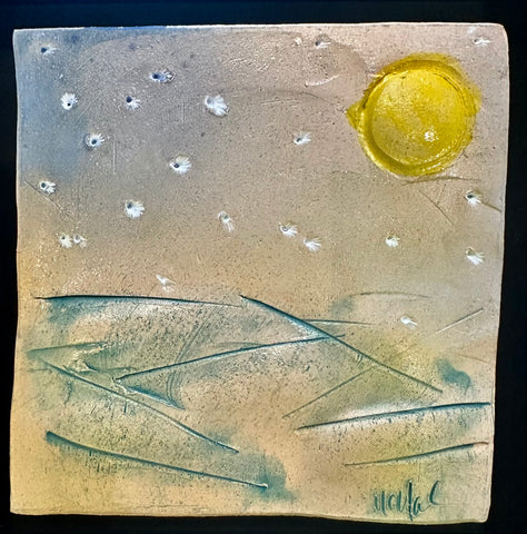 yellow sun; white stars over teal water ceramic tile