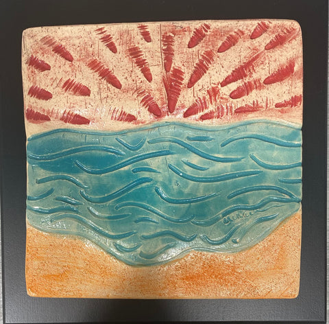 turquoise water under red sun