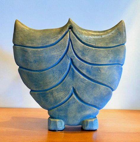 Handbuilt ceramic vessel carved. Blue anvil.