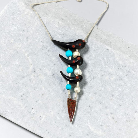 Grenadilla Wood, Turquoise, Pearl, Petrified Dinosaur Bone and Coral Necklace