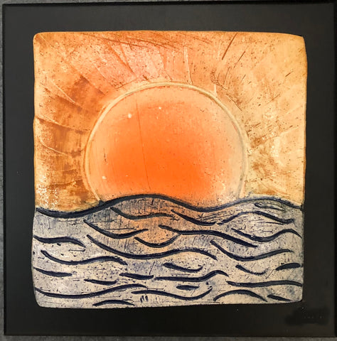 ceramic tile sunset over deep blue water. framed 8x8