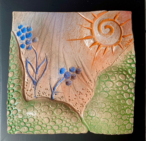 orange spiral sun with blue flowers ceramic tile framed 8x8