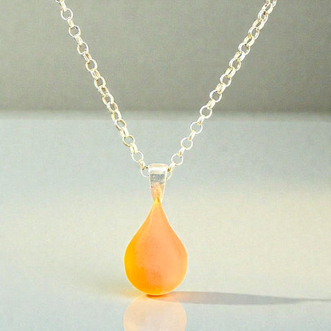 Cast glass orange teardrop pendant with sterling silver rolo chain 