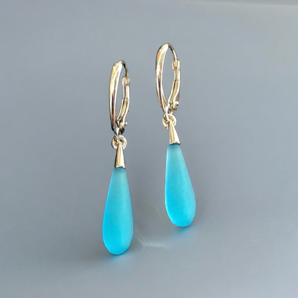 Light blue glass earrings etched like seaglass. Bright & sparkly 