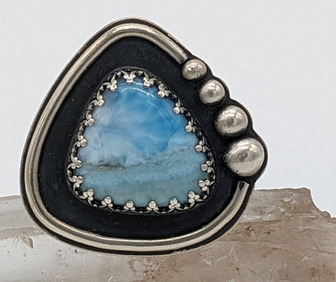 hand crafted sterling silver ring with Larimer seascape stone.