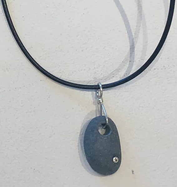 simple basalt necklace with white topaz on a leather cord