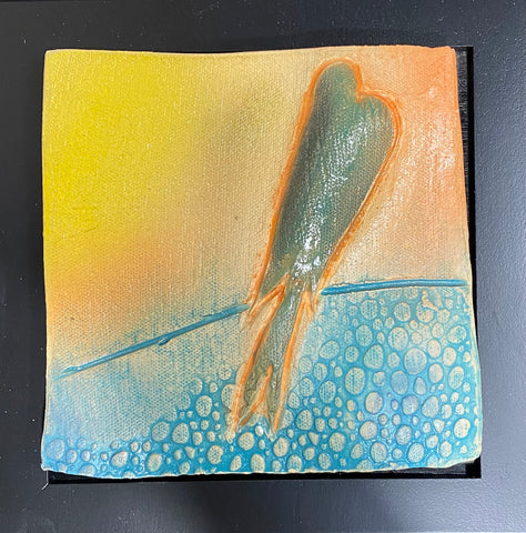 ceramic tile with green bird on wire; golden yellow sky. framed 8x8