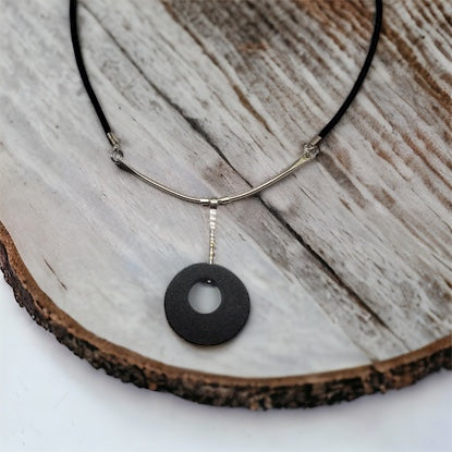 simple basalt stone with sterling silver drop on leather cord. 