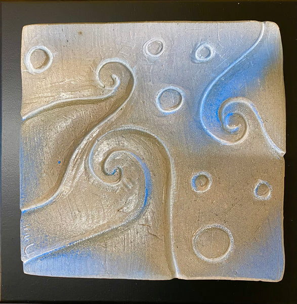 ceramic tile with blue spiral and dots