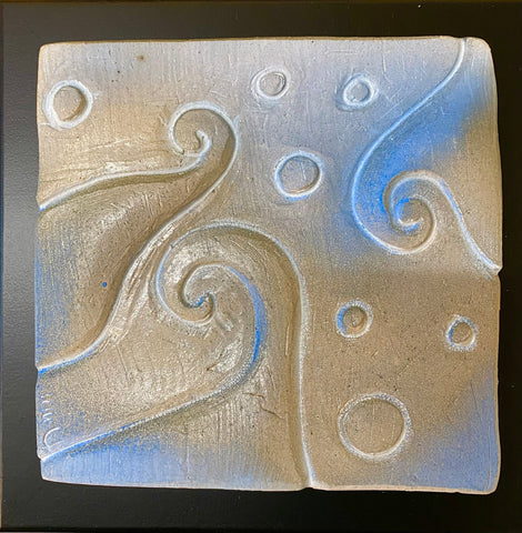 ceramic tile with blue spiral and dots